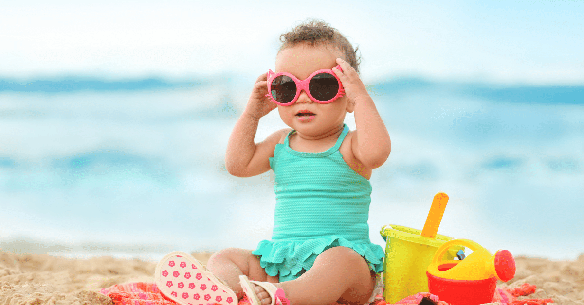 https://blog.urbansitter.com/wp-content/uploads/2013/05/Baby-on-beach.png