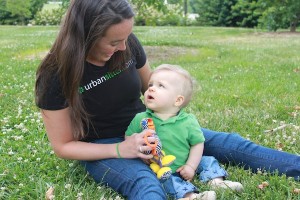 sitter-with-boy-in-grass