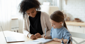 after school nanny helping child with homework