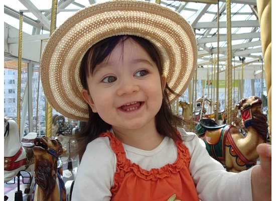 julia - happy girl on carousel