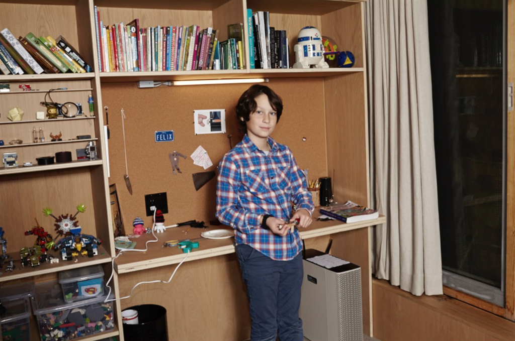 Felix with just some of his collections—and a view out the window of lower Manhattan.