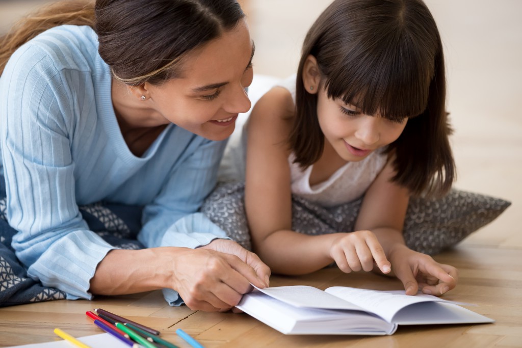 sitter reading to child