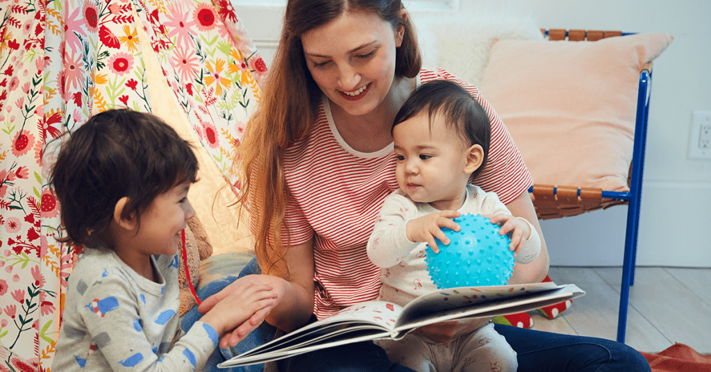 woman-reading-to-two-young-children