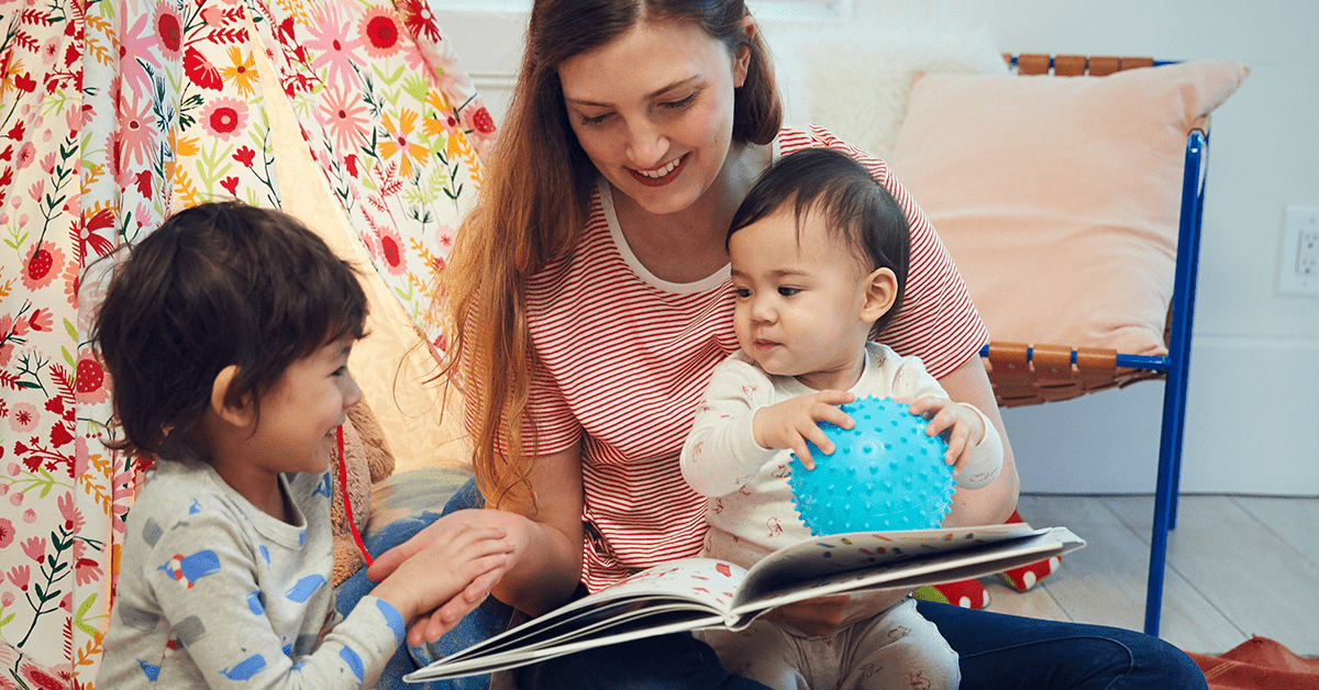 woman-reading-to-two-young-children