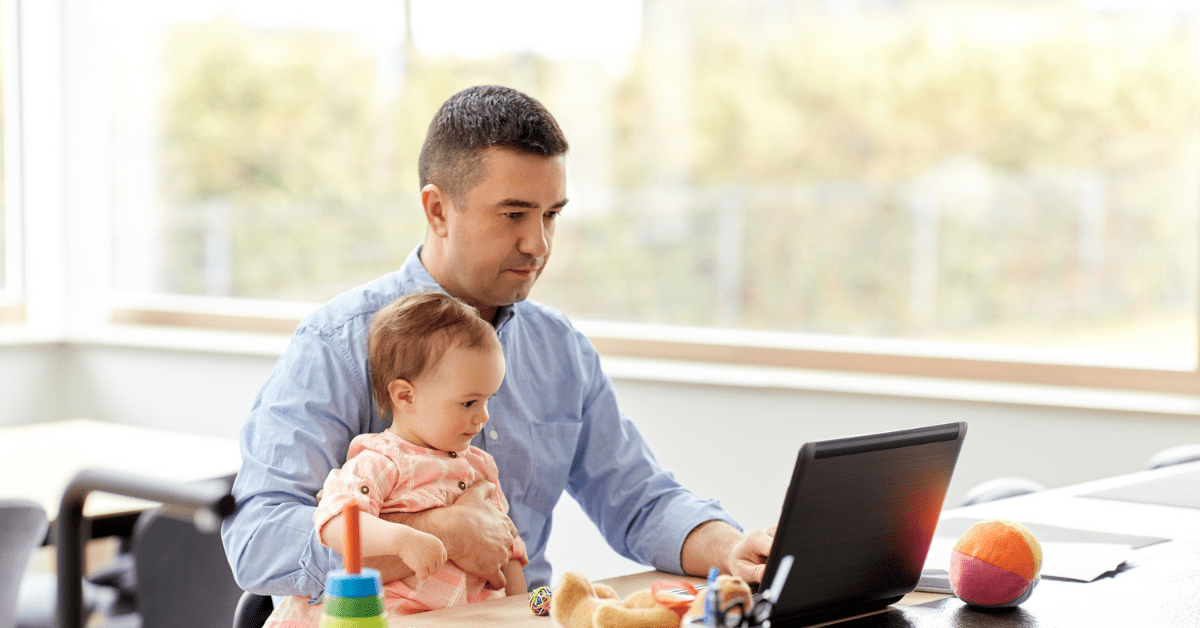 dad working at the table with baby