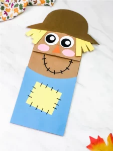 Scarecrow paper bag puppet fall crafts for preschoolers