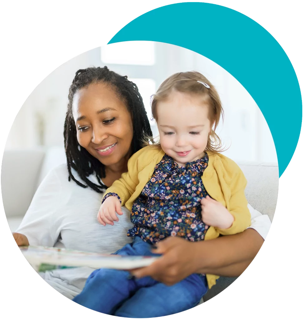 babysitter reading to a happy child