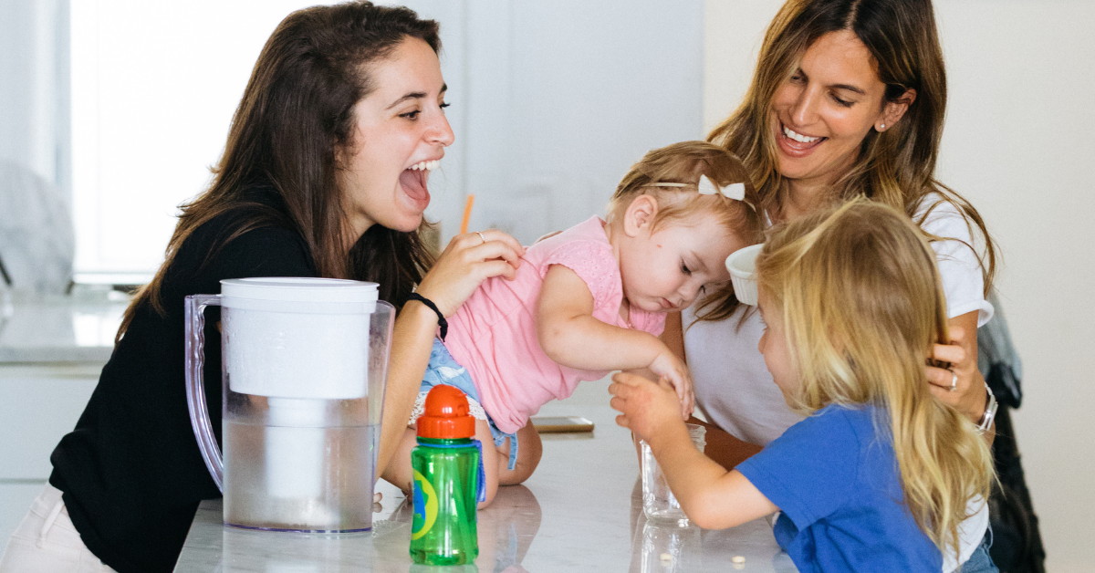 babysitter with two kids and mom