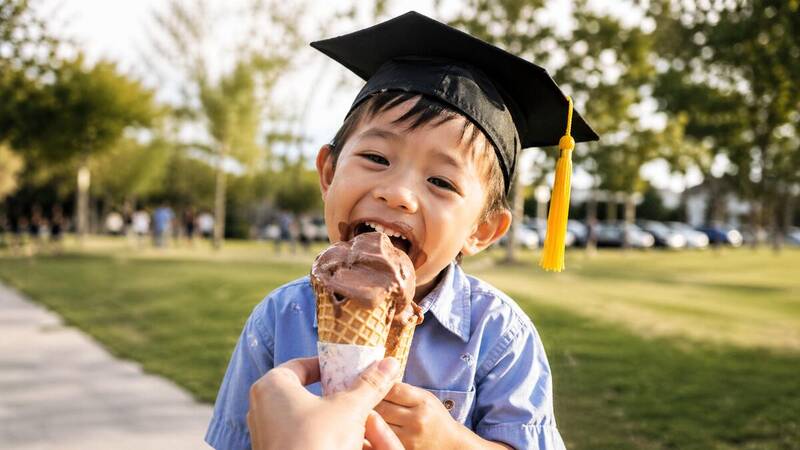 family celebrating kindergarten graduation with ice cream