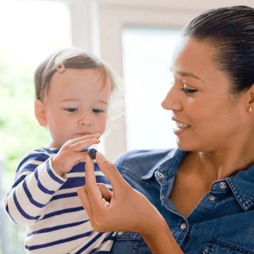 nanny feeding toddler